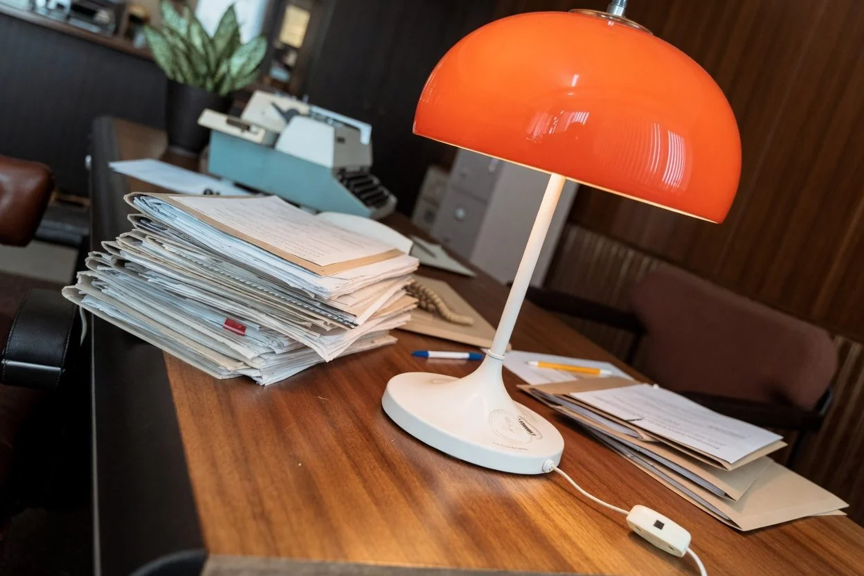 A folder of estate documents, a Form 74.8 affidavit, and a will laid out on a desk in an Ottawa notary office