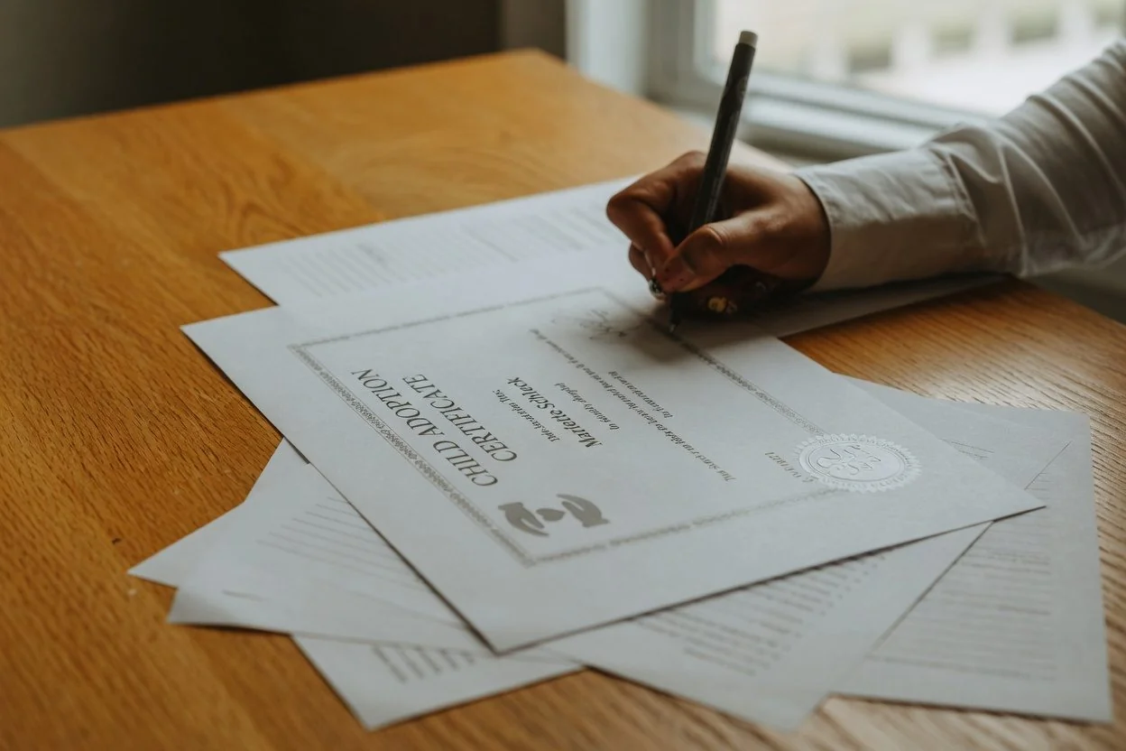 Family and child protection documents on a desk, representing a declaration affirming parentage in Ontario