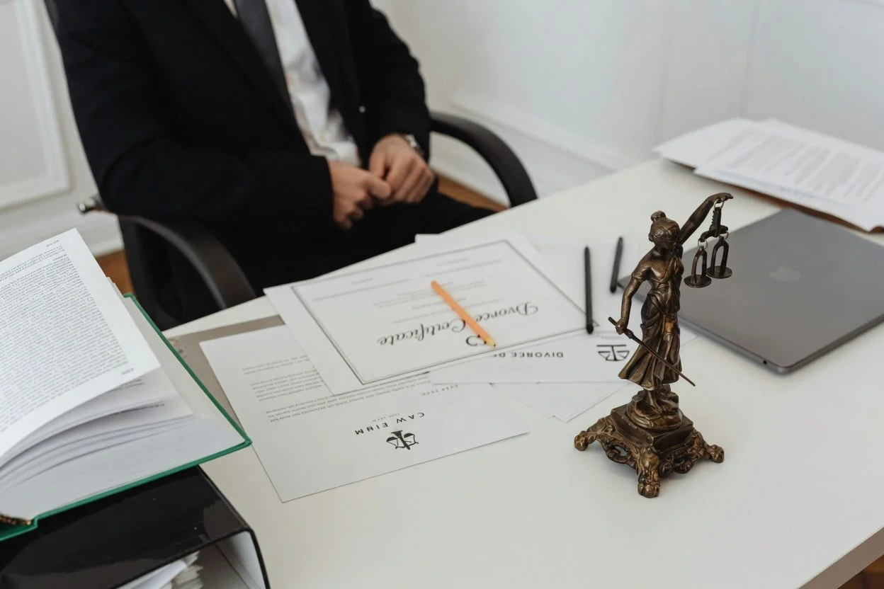 A continuing power of attorney for property document and a power of attorney for personal care document side by side on an Ottawa notary's desk, with two pens and a notarial seal