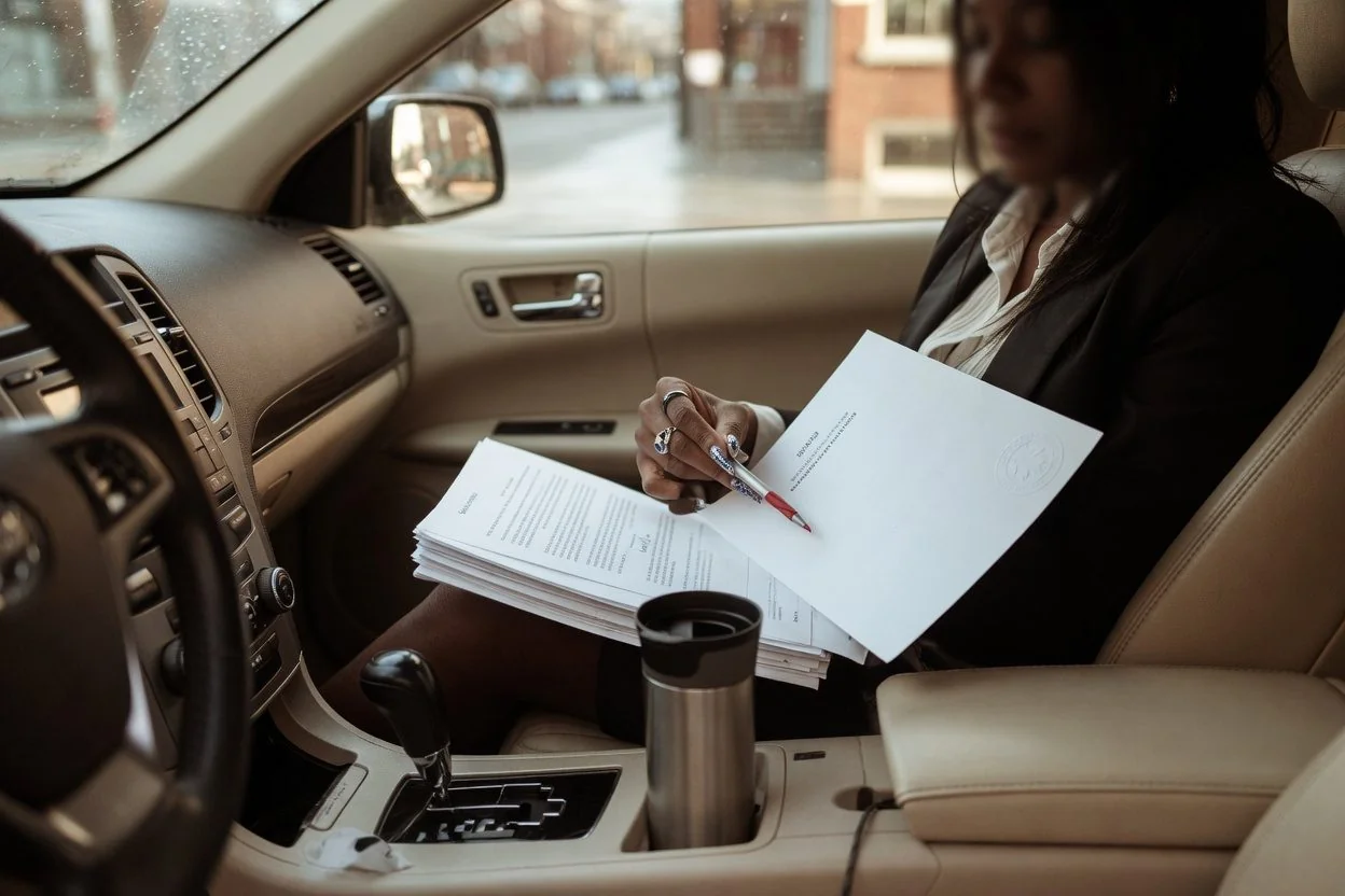 An Ontario notary public seal on a sworn statement, representing a vehicle transfer or family-gift affidavit sworn by video